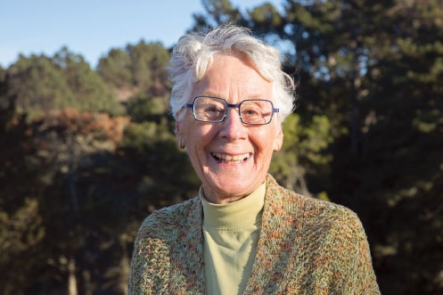 Hanna Rosenblatt Alger ’56, wearing a light-green shirt and printed jacket.